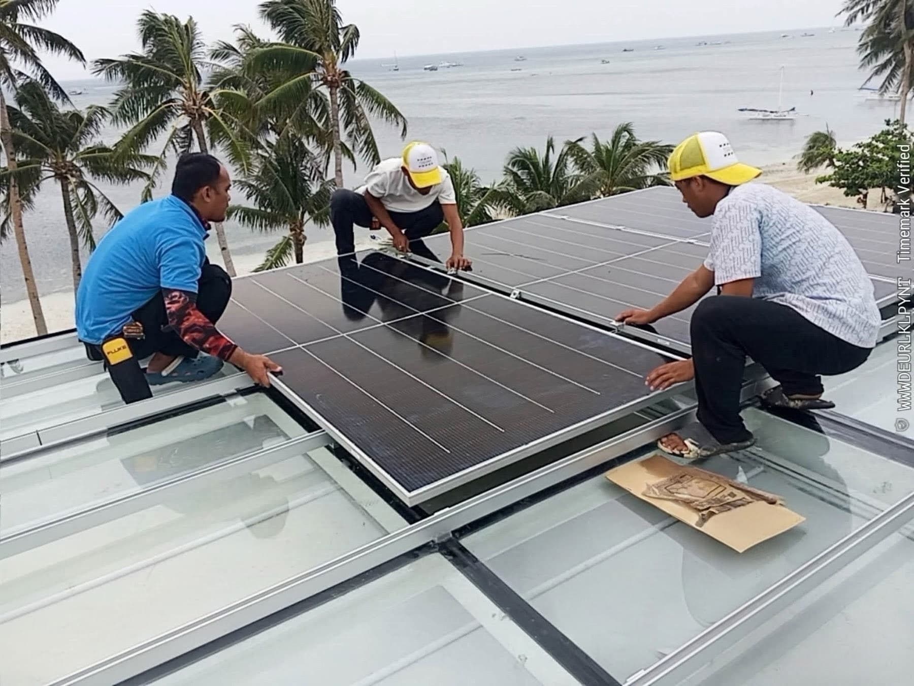 Onsolar installers setting up solar panels in Boracay
